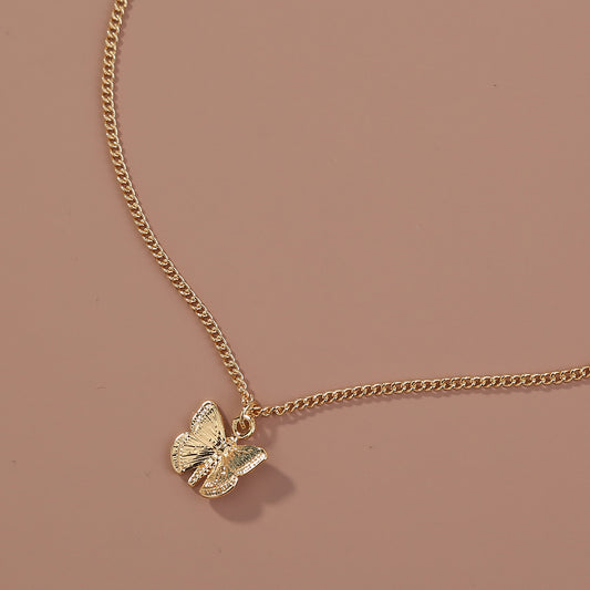 Subtle Charm Butterfly Pendant Necklace in Gold-Tone Alloy